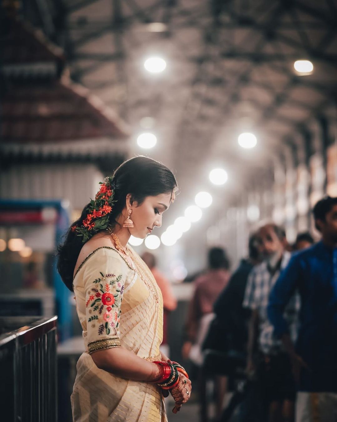 photo of bride wearing bridal saree in traditional style at Hindu temple for wedding